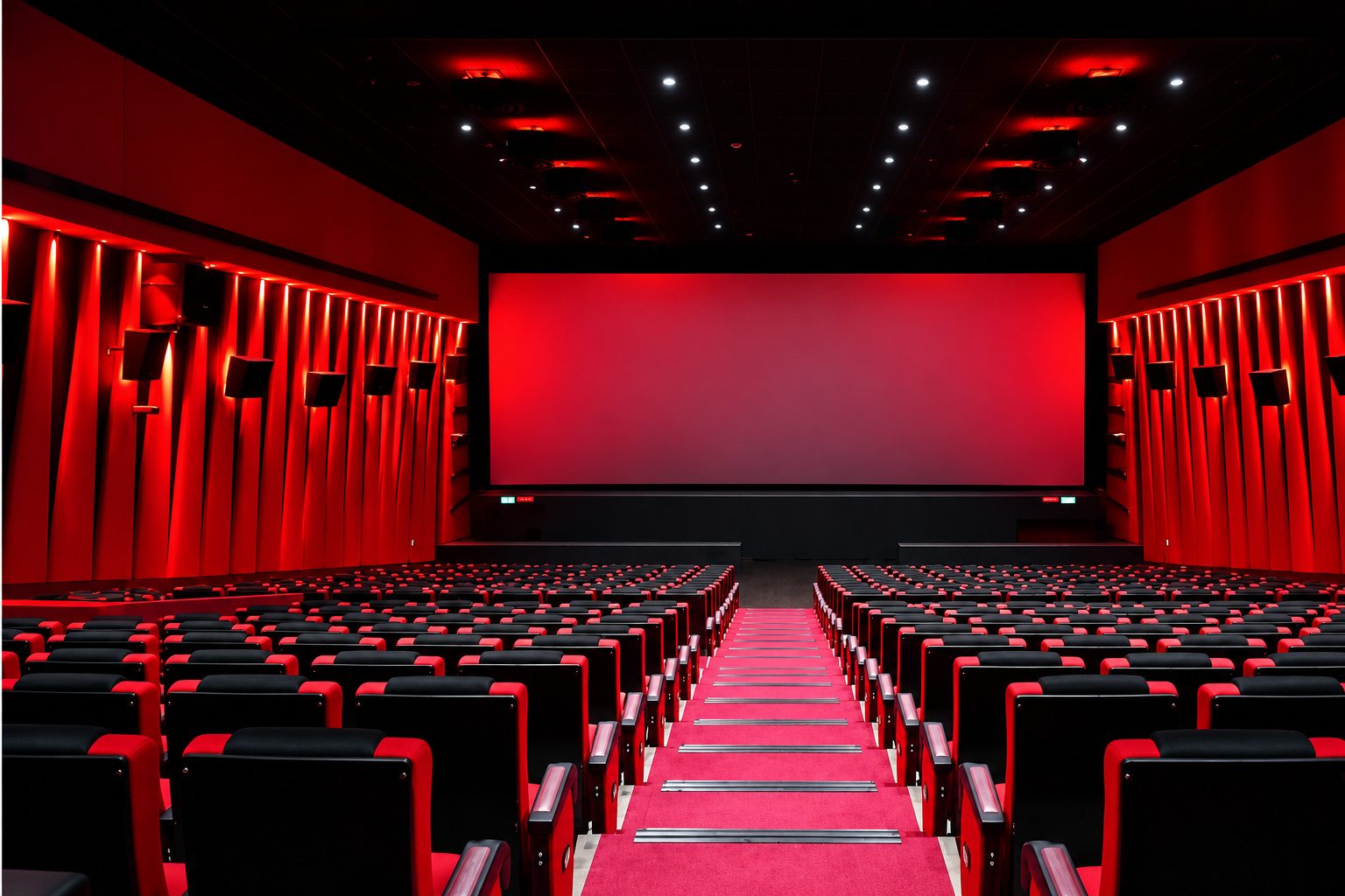 Red commercial cinema auditorium featured with Dev Cinemas in the company profile